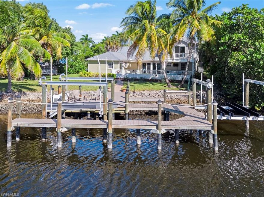 DIRECT GULF ACCESS!!  DEEP WATER!!NO BRIDGES!! BOATERS PARADISE HOME WITH 200+ feet of WATERFRONT!! Welcome to Palm Isles, a small gated waterfront community. This 3 Bed, 3 1/2 bath home offers a large spacious entry and open concept living and dining area. Plantation shutters throughout and LED lighting. Beautifully updated kitchen with Quartz and recycled glass countertops, look out onto your private pool and backyard. Complete with peaceful preserve views. Walk out to your composite boat dock and captains walk with a 14,000 lb boat lift ( new in 2018)and hop in your boat and be in the Gulf of Mexico in 20 minutes! Ideal location just minutes to Ft Myers Beach and Sanibel. Wonderful community with low fees and close to all that SW Florida has to offer!!