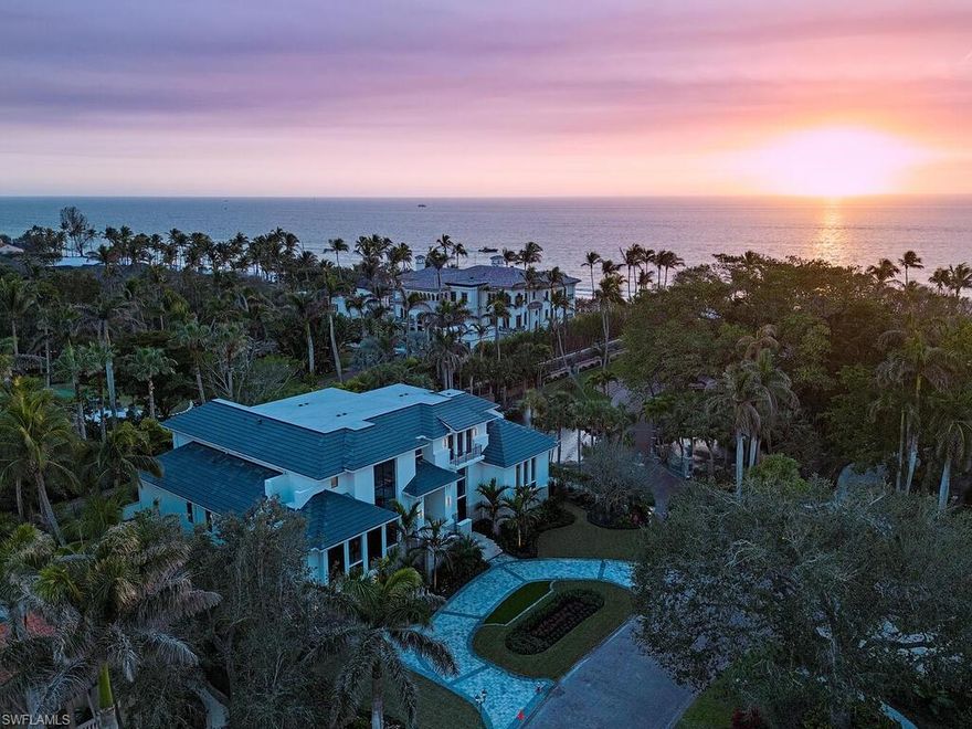 Located in a unique, gated beachfront enclave consisting of a mere nine homes, this newly completed residence penned by Stofft Cooney, built by Equinox Construction, and brought to life by Carrie Brigham Design, is striking and unmatched in the caliber of construction and finishes. A cantilevered walnut staircase flanked by glass balustrades offers intrigue to those who enter the great-room style floor plan hosting 5 bedrooms + club room, 7 full and 2 half bathrooms, a wine room coated in old world antique mirror Argenta tile, walnut flooring throughout, private elevator, and a rarely found 7-car garage. A luxurious kitchen hosts a marble mosaic backsplash, double islands, as well as top-tier appliances. While the grand master bedroom is located on the first floor, the second level features an additional master option with ensuite his and her bathrooms, as well as a VIP suite offering spectacular Gulf views. One can revel in the Gulf views from the sprawling outdoor environs located off of the main living level that provides covered/uncovered areas for relaxation, an infinity edge spa, sunshelf, fireplace, a state-of-the-art outdoor kitchen, and a zero-edge pool below.