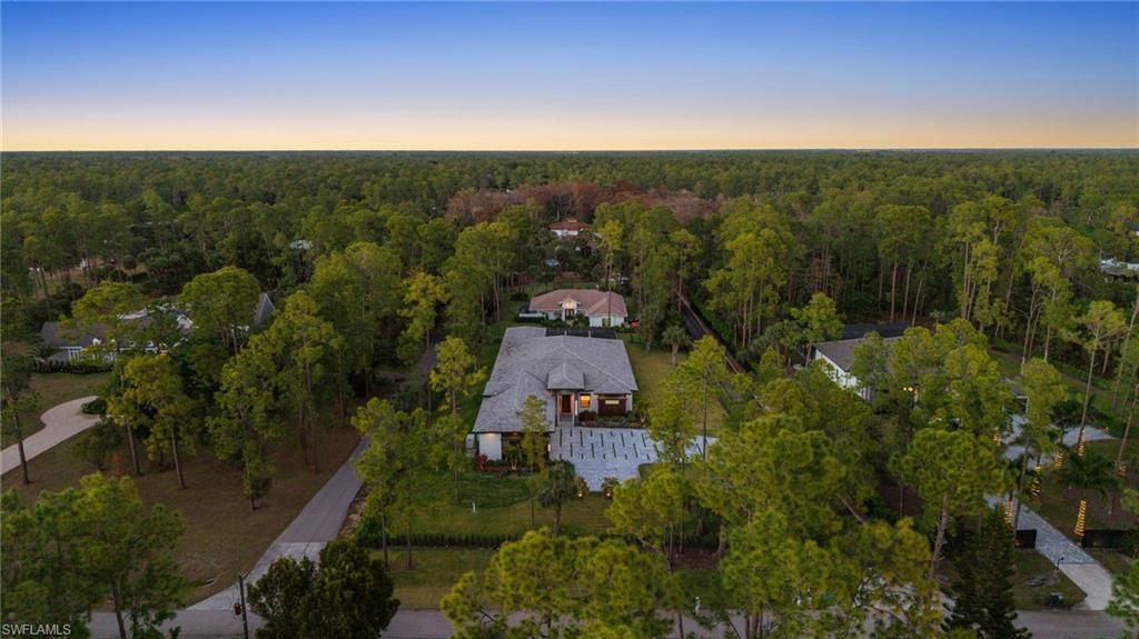 Photo of 4891 MAHOGANY RIDGE DR, NAPLES, FL 34119 (MLS # 226000896)