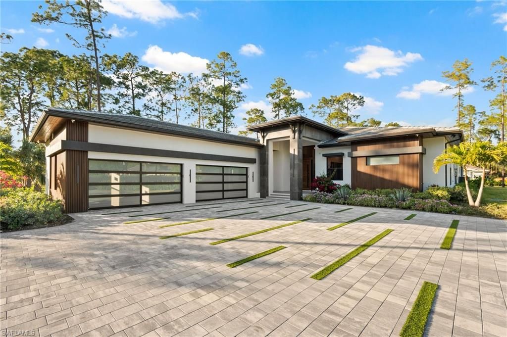 Photo of 4891 MAHOGANY RIDGE DR, NAPLES, FL 34119 (MLS # 226000896)