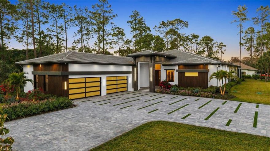 A rare opportunity to own a newly completed estate in the highly desirable Logan Woods community, where privacy and space meet the convenience of in-town living. Situated on a generous homesite and completed in 2026, this exceptional new construction residence showcases luxury craftsmanship, high-end finishes, and expansive living spaces designed for both everyday comfort and grand entertaining.

The thoughtfully designed floor plan offers an abundance of living space, featuring multiple spacious bedrooms, a private guest suite, and a dedicated exercise room. At the heart of the home, the chef’s kitchen is a true showpiece, appointed with top-of-the-line appliances, custom cabinetry, and stunning designer countertops, all flowing seamlessly into the main living areas.

A spectacular, climate-controlled wine room serves as a dramatic focal point and conversation piece, perfect for showcasing a prized collection while adding architectural interest and sophistication to the home.

Designed to embrace the Florida lifestyle, the expansive outdoor living area is an entertainer’s dream. The resort-style pool and spa are surrounded by generous covered living spaces, multiple dining areas, and a fully equipped outdoor kitchen, creating the perfect setting for hosting gatherings or enjoying peaceful evenings in your own private retreat.

Hosting family and friends is a breeze with separate full residence with Garage on the property. Also, the perfect set up for extended family or aging parents.

Offering the best of both worlds, this Logan Woods estate provides the tranquility of estate living with close proximity to Naples’ world-class dining, shopping, beaches, and everyday conveniences.