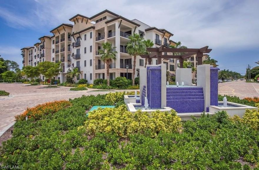 Stunning 2 Bedroom Plus Den 2 Bath Naples Square Condo overlooking tranquil pool/courtyard area. This condo features beautiful plank tile, upgraded cabinets with trash pull out, and drawer microwave, kitchen back splash, hood above range, listello accent in shower and dual sinks in master bath, and additional listello accent in guest shower as well. Custom wall with niche with light in foyer in the entry way. Naples Square features beautiful pool/hot tub courtyard area with gas grills, social room, exercise room, and below building gated garage parking with private storage area. Walking distance to downtown, restaurants, shops, and beaches. As well as shops and restaurants at Tin City and Bayfront. Very close to the Greenway, which provides miles of biking and walking trails through the mangroves.  (Parking space: #427)