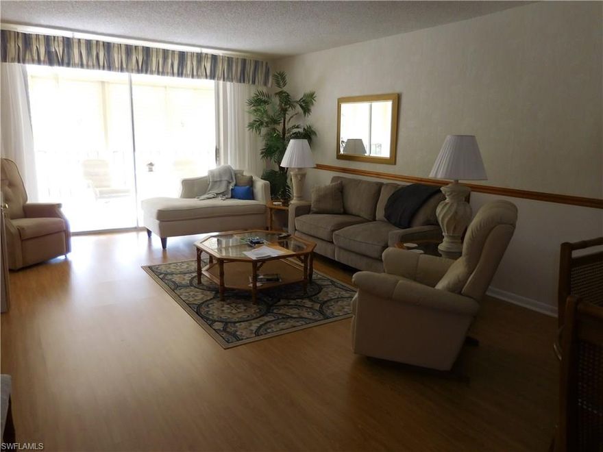 HR2 204 Life is beautiful and so is the view of the golf course from your private screened lanai and the water feature from your kitchen window. This largest model boasts an eat in kitchen, walk in closet and dressing vanity area in the master, an external storage unit, easy care tile and laminate floors with carpet in the guest room. Ready for you with all appliances, turnkey furnished, perfectly situated on the second floor.  You can take the stairs or ride the elevator. No worries electric hurricane shutters. Your Naples home can be used all year round or escape the harsh winters and be a "snowbird".  All this in a lushly landscaped fun and friendly 55+ community with over 900 palm trees on the property.  Pickle ball, bocce, tennis, cards, bingo, pasta dinners, hot dog days, coffee socials and much, much more.  Nine miles from downtown Old Naples and the beach. Close to shopping, dining all that Naples has to offer.  30 minutes to the RSW airport