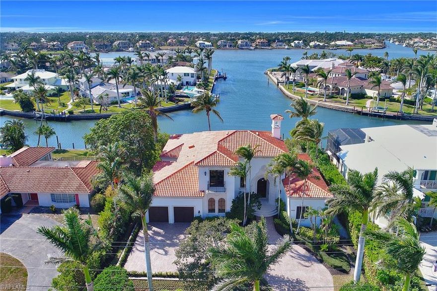 Expansive panoramic water views of the channel and Naples Bay. Beautifully situated on 0.40 acres, with 101 feet of deepwater frontage with direct Gulf of Mexico access. This four-bedroom-plus-den, four-and-a-half-bath home offers impressive, western exposure with approximately 4,377 square feet of living space and 5,751 square feet of total build. An infinity-edge lap pool and spa, large outdoor kitchen and bar, covered living loggia and an open terrace are the perfect places to watch sunsets over the water. Boating enthusiasts will enjoy the 20,000-pound boat lift and separate jet ski lift, making it the perfect boating paradise. Custom-built in 2004, the home boasts exquisite amenities and fine appointments throughout. Highlights include a formal living room with floor-to-ceiling windows providing incredible water views, a formal dining room, butler’s bar, a gourmet kitchen with top-of-the-line appliances and breakfast nook, a spacious adjoining family room with breathtaking water views and luxurious private master suite with French doors opening onto the pool deck. Ideally located less than five minutes to downtown Fifth Avenue South, Third Avenue South and the beach.