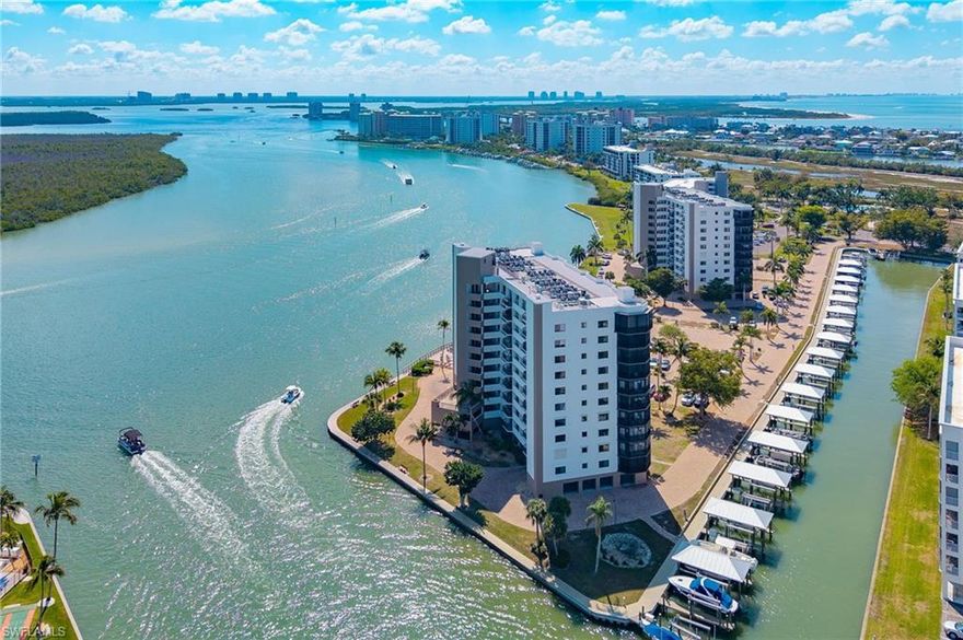 Stunning 5th floor condo in the Harbour Pointe community! This 2 bed/ 2 bath condo is sold turnkey and showcases both Gulf and Bay views. BOAT SLIP #34 with Electric 10,000 lb lift is INCLUDED.  The spacious primary bedroom features an ensuite bathroom, walk in closet and private lanai access. Electric hurricane shutters! The kitchen boasts brand new appliances, perfect for preparing meals while enjoying those incredible water views. Enjoy the community pool or explore the extensive EBIA offerings including deeded beach access, pickleball and tennis courts, bocce ball, golf driving cage, putting greens, dedicated beach parking, and scenic walking paths. Located on the south end of the island, placing you close to Lovers Key State Park's natural beauty, Santini Plaza's conveniences, and an array of dining and shopping options. Don't miss this opportunity to own your piece of paradise!