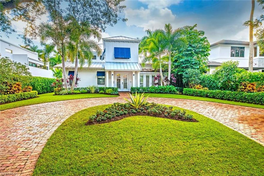 This charming home located on one of the most desirable, tree-lined streets in Old Naples is just three short blocks from the sandy Naples shoreline. Providing all the comforts of home, this 3,100 square foot residence has been completely remastered with all new wood flooring, all new kitchen and bathrooms, new roof, impact windows and doors and custom ceiling details. The inside flows effortlessly to the outdoors where you will find a heated pool and spa, summer kitchen and fire pit. Detached from the main home is a private guest cabana featuring a bedroom and bath as well as a 2-car garage accessible from the back alley. Master bath located on the second level. Home being offered furnished and ready to enjoy.