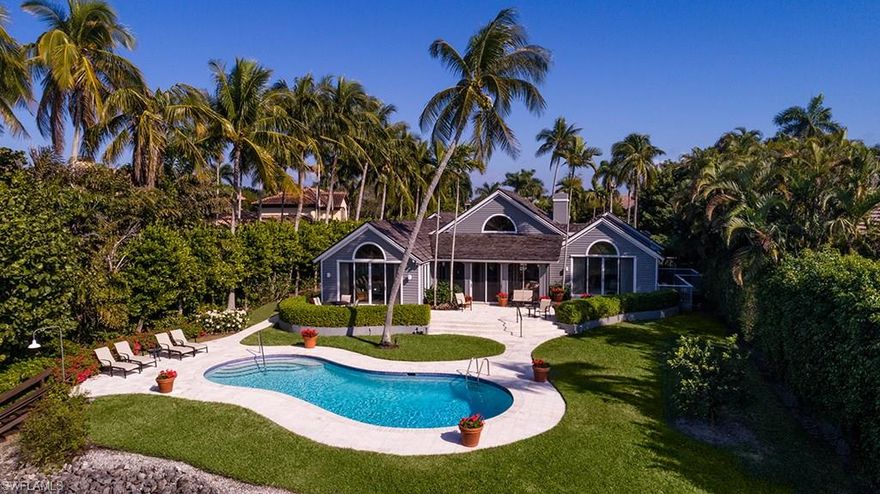 Beautiful environmental views along quiet Old Harbour Channel. Very quick boating access to Gordon Pass and the Gulf of Mexico. Not far, as well, from all the amenities of the Port Royal Club, with its world class dining and beachfront experience. The Port Royal Club's superb tennis center and fitness facility are also within easy reach. The home is a comfortable and easily managed one-floor design. Superior spatial relationships allow a very private master bedroom with exceptional water views. Two guest bedrooms with an additional entirely separate bedroom suite accommodation for staff or longer term visitors. Large living room with fireplace and connecting outside screened porch overlooking the pool and tree-lined waterway beyond. Wonderful family/dining room with open kitchen to meet the desires of modern living. A beautiful site and an exceptionally lovely home. Port Royal Club eligibility.