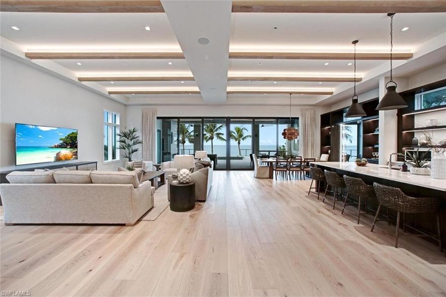 DIRECT BEACHFRONT MASTERPIECE UNDER CONSTRUCTION & SCHEDULED FOR COMPLETION END OF 2021! This state-of-the-art home is built by Gary W Lau, Inc. Custom Homes with award-winning architect Rich Guzman of R.G. Designs, Inc & impeccable interior design by Adelyn Charles Interiors. Enjoy the sugar sand & turquoise Gulf of Mexico waters as your backyard with unbeatable views. Only the finest features & finishes from the whole house wood & tile floors, Cypress ceiling details, quartz/granite counters & all solid wood cabinetry. Dramatic open floor plan with AUTOMATIC pocketing sliders to the oversized pool deck with saltwater pool, spa & outdoor kitchen. This 5 bed + den, 5.5 bath, 5,000+ sq ft A/C home is on an extra deep lot with one of the largest floor plans on the island. Offers incredible master suite with spa-like bath, 2 laundries, flex room overlooking the Gulf of Mexico with wet bar & garage with room for 6+ cars. Chef’s gas kitchen includes Thermador appliances, eat-in bar, catering kitchen & stunning glass wine display case. Features include Sonos surround sound system, electric screens & shutters, impact glass windows/doors, Lutron smart lighting system & private elevator.