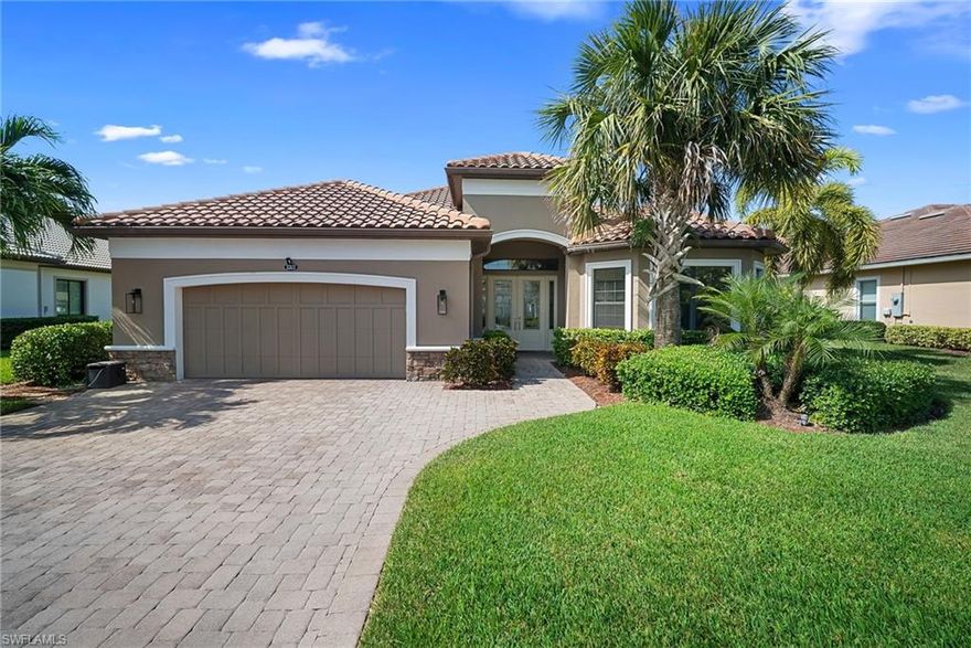 Welcome to one of the FINEST homes in the Country Club at River Hall! Perfectly located just minutes from the clubhouse, this Pallazio floor plan by Taylor Morrison offers 3 bedrooms plus a den, 3 full bathrooms, and OVER 3,000 sqft of thoughtfully designed living space. With tile and luxury vinyl plank flooring throughout, this home is LOADED WITH UPGRADES and ready for its new owners! As you pull into the pavered driveway, you’ll immediately notice the mature landscaping, modern light fixtures, and CUSTOM garage door. Step through the double front doors with a transom window into a bright foyer accented by wainscoting and CROWN MOLDING that flows throughout the home. To your right, the guest suite offers privacy with its own EN-SUITE bath, featuring a walk-in shower and vanity, ideal for visitors. Across the hall, the den with double French doors, custom shelving, and a Murphy bed adds flexible living space for a home office or extra guests. Continue into the OPEN-CONCEPT main living area, where natural light fills the space. The dining area is accented by custom mirrors, while the living room showcases TRAY CEILINGS, and wide-plank luxury vinyl flooring. The kitchen is light and bright, featuring white shaker cabinets, a beautiful tile backsplash, granite countertops, stainless steel appliances with matching hood vent, oversized island, and a walk-in pantry! This space was designed for entertaining, and more importantly, effortless everyday living. The primary suite, tucked away for privacy, boasts an IMPRESSIVE SIZE. It includes tray ceilings, a large walk-in closet with custom shelving, and a luxurious double-entry shower with multiple shower heads, including a rainfall feature. Dual vanities, a makeup counter, and a private water closet complete the suite.
Step through the sliding glass doors to the screened lanai, the true CENTERPIECE of this home’s design. Enjoy a heated pool and spa, OUTDOOR FIREPLACE, and a fully equipped OUTDOOR KITCHEN with propane grill, hood vent, and rock backsplash, perfect for year-round Florida living. ADDITIONAL HIGHLIGHTS include custom shelving in all closets, surround sound speakers throughout, a laundry room with a utility sink and overhead cabinets, and side-by-side washer and dryer, plus a garage with overhead storage racks for convenience. Enjoy the 18-hole championship golf course designed by Davis Love III and experience resort-style living at its finest - all with low golf and HOA fees! The community offers a lakeside pool with a Tiki Bar and restaurant, a separate golf clubhouse with its own dining, a resort-style pool, full fitness center, pickleball and tennis courts, an on-site elementary school, and a brand-new fire station for added peace of mind. This home perfectly balances elegance, comfort, and functionality. Centrally located with easy access to Palm Beach and I-75, providing a straight shot to Downtown Fort Myers, RSW Airport, & SWFL dining and shopping. The only thing missing is YOU!