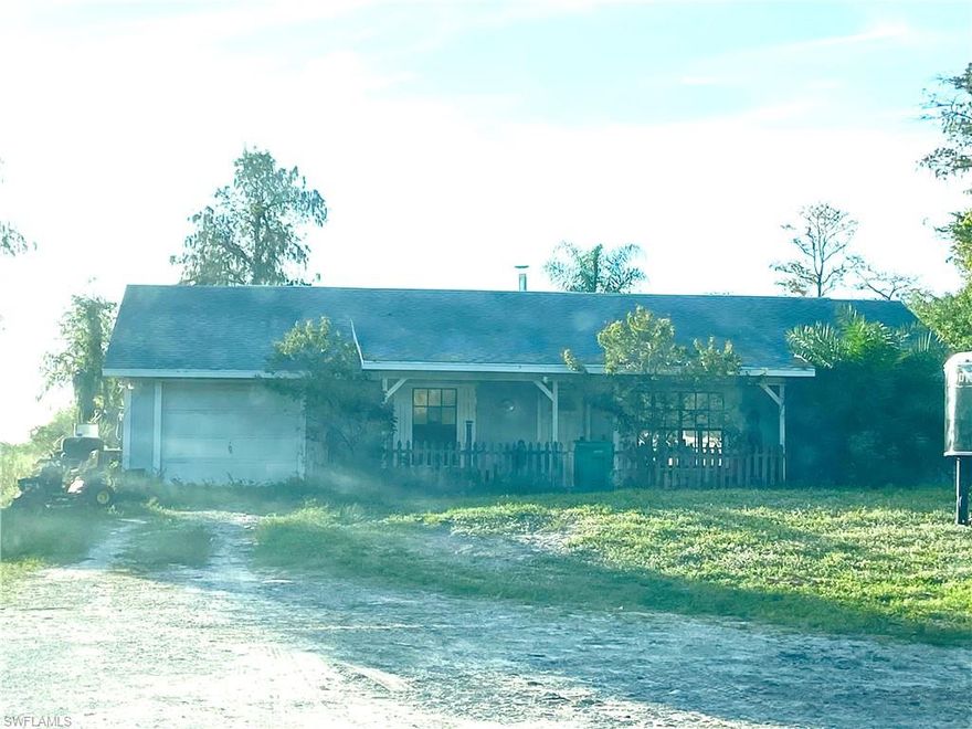 Great location in Golden Gate Estates! 3 bedroom/2 bath, a Pool with Jacuzzi.on 1.59 acres. The property is completely fenced in set up perfect  for horses. A round pen and portable barn on property that are negotiable if buyer would like to keep them.