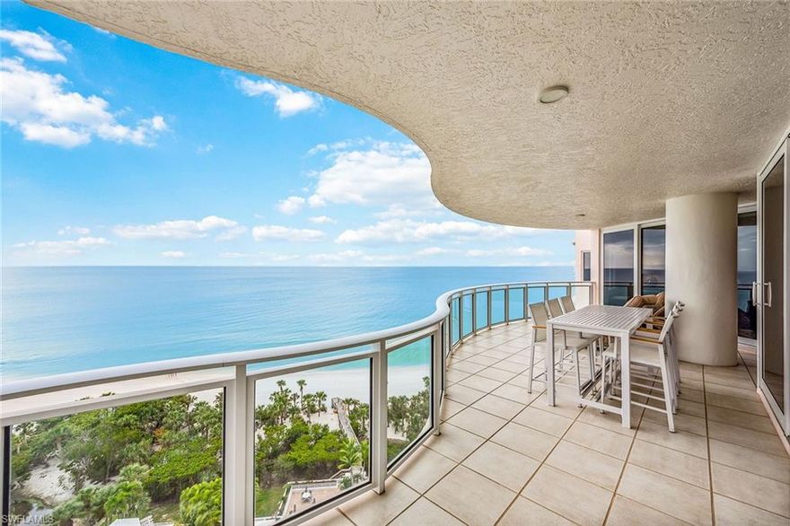 Gorgeous gulf views! Rarely available, higher-floor end unit on the beach in the private gated community of Bay Colony in Pelican Bay. Featuring panoramic views of the Gulf of Mexico through a floor-to-ceiling sliding glass door that opens onto a spacious wraparound lanai. This highly sought-after floor plan welcomes you into an elegant entry foyer with spacious living and dining areas including an entertaining bar area with a wine cooler, wet bar and seating. An updated kitchen with dovetail joint quiet-closing cabinetry, Sub-Zero refrigerator and granite island. The adjacent den offers plenty of room for entertaining family and guests, along with three full bedrooms, all with en-suite baths. The Brighton amenities include a 24-hour staffed front desk, guest suites, fitness center, social room and a resort-style pool. Bay Colony residents enjoy the use of their own private, renovated beach club and restaurant, a tennis club, as well as use of the amenities of Pelican Bay. Private golf memberships are available separately.
