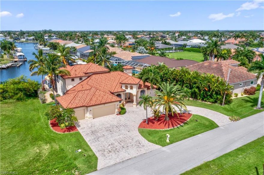 Located just minutes from Cape Harbour, this impressive 4-bedroom, 4-bathroom pool and spa home offers the perfect blend of luxury, space, and long water views in one of Southwest Cape Coral’s most desirable neighborhoods.
Designed for both everyday living and entertaining, the home features a spacious open floor plan with expansive sliders that frame the stunning canal view. The kitchen flows seamlessly into the main living and dining areas, creating an inviting space for gathering with family and friends.
Step outside to your private waterfront retreat. The oversized lanai showcases a sparkling pool and spa overlooking a wide canal with picturesque long water views — the ideal backdrop for enjoying Florida sunsets and outdoor living year-round.
Each of the four bedrooms offers comfort and privacy, with well-appointed bathrooms that provide convenience for guests and family alike.
Situated near Cape Harbour’s waterfront dining, shopping, and marina, this home places you close to everything while still offering the peace and privacy of canal-front living.
New stone coated metal roof March 2023.
Schedule your private showing and experience the waterfront lifestyle this exceptional property delivers.