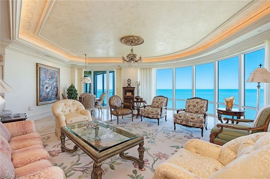 Situated directly on the beach. Savor explosive views capturing the ultimate seaside setting, nestled in the heart of Gulf Shore. Estate 12 North of The Regent boasts an incredibly spacious interior, encompassing over 7,600 square feet featuring dramatic walls of glass, panoramic Gulf and bay views and expansive terraces with all-new state-of-the-art glass railings. The architectural design offers numerous unique custom features complementing the marble floors throughout, delightful gourmet kitchen, private library and five masterfully crafted bedroom suites. In addition to the exceptional specifications such as the 10-foot-high ceilings, 8-foot tall doors and secured private elevator entry, Estate 12 North enjoys three car spaces ideally located. The unsurpassed collection of amenities, along with the outstanding, all-new beachside terrace with pool and spa, top-notch security and the utmost in privacy, epitomize the finest of Naples lifestyle.