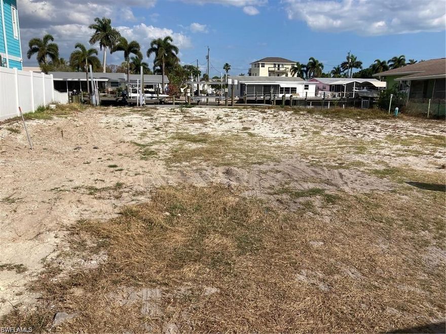 WOW! OWNER FINANCING!! AMBERJACK HARBOR, CLEARED 60FT. WIDE LOT southern exposure, WITH DIRECT GULF ACCESS, NO BRIDGES, DEEP WATER DOCKAGE, NEW SEAWALL, NEW WRAP AROUND COMPOSITE DOCK WITH NEW REMOTE CONTROLED 10K LB. BOAT LIFT AND 2 JET SKI LIFTS, WATER AND ELECTRIC @ DOCK, MINUTES AWAY FROM BOCA GRANDE WITH THE BEST TARPON FISHING IN THE WORLD! READY TO BUILD ON, WATER AND SEWER, LOCATED IN MATLACHA, A KEY WEST STYLE AREA WITH SHOPS, RESTAURANTS, SHRIMP DOCKS,TWO PUBLIX SHOPPING CENTERS CLOSE BY, FORT MYERS, SANIBEL ISLAND AND NORTH CAPTIVA BEACHES MINUTES AWAY, NEW MULTI MILLION DOLLAR RESIDENCES UNDER CONSTRUCTION!!!!! SURVEY PROVIDED SURVEY VERIFIES 60ft.X80ft. SURVEY COMPLETED PRIOR TO NEW DOCK AND SEAWALL INSTALLATION, 3 BED 3 BATH 3,068 S/F RESIDENTIAL PLAN AVAILABLE