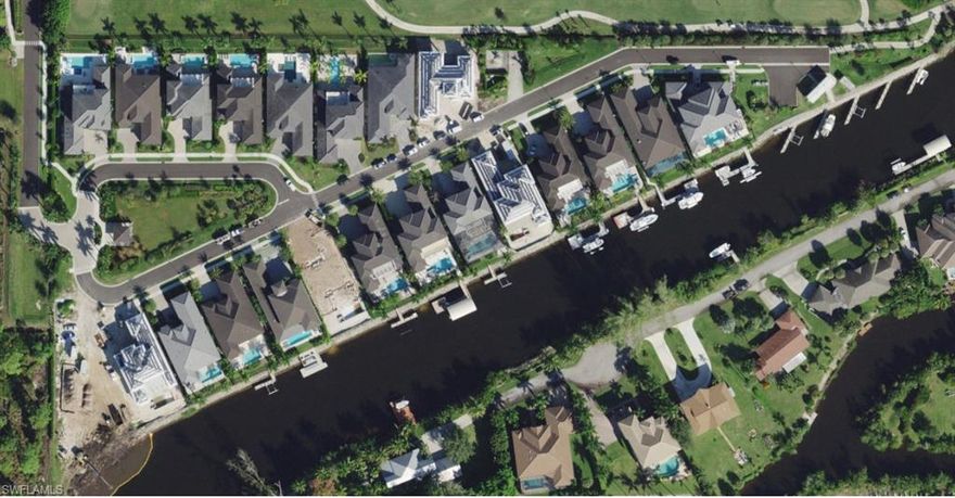 Completion: March 2021.
1664 Vinland Way is the one & only remaining new construction waterfront home opportunity in the Landings at Bear's Paw! This custom 2-story home has been meticulously designed by MHK Architecture and Planning, with several special additions and customizations added in the field. 
The Landings offers the rare opportunity to boat to the Gulf of Mexico from your private dock, hop on a golf cart to the brand new Bear's Paw Country Club clubhouse for golf, fitness, dining, and social clubs, AND access Greenway Park for bike and jogging paths all the way down to Baker Park. The Landings is truly in the heart of Naples, equidistant to Mercato and Downtown, and just 4 miles from amazing beaches.
1664 enjoys prime outdoor living, with southern exposure over the canal, a spectacular custom salt pool and spa, an outdoor kitchen and enormous outdoor bar, and private dock. Interior features include elevator prep, two bars, Sub-Zero/Wolf chef's kitchen, wide plank wood floors, and custom tile, cabinet, and design features throughout. Quartz countertops, tongue-and-groove ceiling treatments, and home automation bring this home to the highest level of luxury and ease.