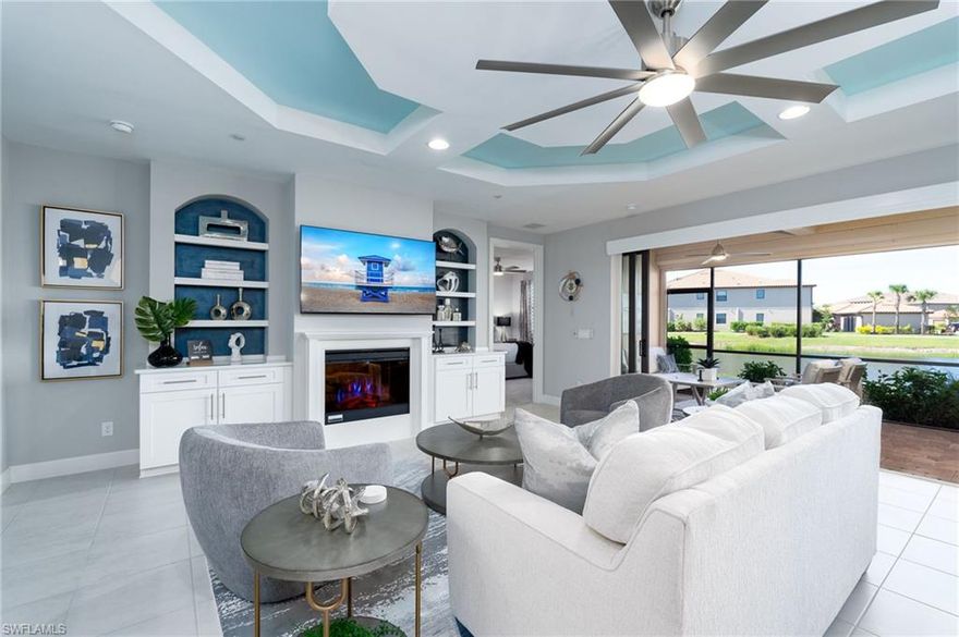 Welcome to your slice of paradise in Naples!  This beautifully decorated first-floor coach home is located in the highly sought-after resort-style community of Esplanade Golf & Country Club and is offered completely turn-key—just bring your suitcase and start enjoying the Naples lifestyle.  This luxurious 2-bedroom, 2 full bath residence with a 1-car attached garage features a spacious and inviting open-concept great room floor plan. Thoughtfully upgraded throughout, the great room showcases tray ceilings, custom built-in cabinetry and shelving, upgraded lighting, remote-controlled window coverings, plantation shutters, and ceiling fans. The home also features custom closets for optimal organization and storage.  Enjoy breathtaking western exposure from your oversized screened lanai—perfect for taking in the stunning Naples sunsets. The lanai overlooks a tranquil pond with picturesque golf course views just beyond, offering a serene and private outdoor retreat. Storm Smart shutters provide added protection and peace of mind.  This property includes a Social Membership, granting access to the exceptional amenities.  Residents enjoy a resort-style pool with cabanas and a poolside Bahama Bar, tennis and pickleball courts, bocce, a full-service spa, fitness center, dog park, and 14 miles of scenic trails. The community also features an 18-hole private golf course with limited year-round play opportunities. On-site dining includes a restaurant, bar, wine tasting room, and café.  Exciting enhancements are coming soon in 2026, including a fully renovated and expanded poolside Bahama Bar, a new outdoor bar at the Barrel House, expanded golf practice facilities, and a state-of-the-art air-conditioned indoor pickleball complex with four courts.  For added value, the special assessment has been PAID IN FULL!!  This is a rare opportunity to own a beautifully upgraded, move-in-ready coach home in one of Naples’ premier communities.