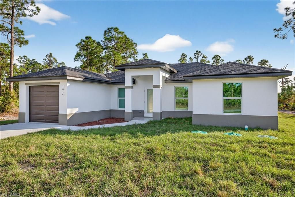 Photo of 1044 Cresthaven ST, LEHIGH ACRES, FL 33974 (MLS # 225083585)