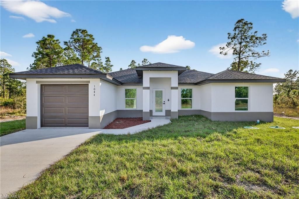 Photo of 1044 Cresthaven ST, LEHIGH ACRES, FL 33974 (MLS # 225083585)