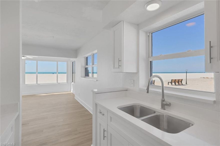 From early morning walks on the beach to the most picturesque sunsets imaginable, experience the very best of beachfront living in this rare, first-floor 2-bedroom, 2-bath residence in the highly sought-after Privateer on Fort Myers Beach. Perfectly situated within the community, this unit boasts truly direct, unobstructed Gulf-front views—an exceptional vantage point that many other residences simply do not offer. From your own home, take in sweeping panoramas of the widest stretch of the island’s sugar-white sands and the sparkling waters of the Gulf, where breathtaking sunsets and balmy coastal breezes become part of your everyday routine.
Inside, the bright, open floor plan is filled with natural light from walls of windows framing the beach beyond. Thoughtful updates and improvements create a move-in-ready retreat, including new flooring, fresh paint, a new A/C system, stainless steel appliances, and beautifully refreshed kitchen and baths. The spacious Gulf-facing living area flows seamlessly, offering a relaxed indoor-outdoor connection ideal for morning coffee with the sunrise or evening cocktails as sun sets over the surf. Lovingly maintained and never rented, this condo blends nostalgic Old Florida charm with tasteful modern enhancements.
The Privateer community itself is undergoing exciting revitalization, reflecting strong ownership and a proactive association. Residents enjoy direct private beach access, BBQ and picnic areas, scenic community patio area to watch sunsets, exciting landscape enhancements underway and a newly renovated community pool. Located on the tranquil south end of the island, you’re just minutes from the island’s vibrant comeback, with new and returning restaurants, shops, and entertainment adding to the energy and appeal. Importantly, this residence did not experience flooding from Hurricanes Helene or Milton, and all prior repairs have been completed—offering both peace of mind and lasting value.
With nearly eight miles of pristine shoreline at your doorstep and unmatched, unobstructed beachfront views from one of the most desirable positions in the community, this is more than a condo—it’s a front-row seat to paradise and an extraordinary opportunity to own in one of Fort Myers Beach’s most iconic Gulf-front enclaves.