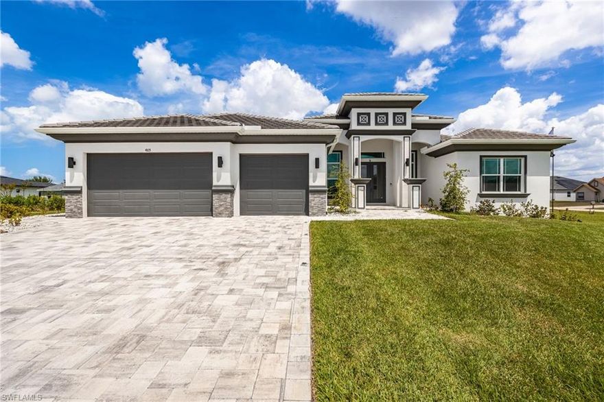 Experience Custom Luxury on 5 Lots totaling approximately .60 Acres in an Emerging Area of Cape Coral with exciting future growth, with this Custom-Built Tundra Home. Designed with intention, scale, and high-end finishes, this home stands apart from typical new construction.

From the moment you arrive, the Architectural Stone Detail, Tile Roof, Grand Columns, and Expansive Paver Driveway set the tone. A Double Door Entry opens to a Wide Foyer and leads into the Great Room, where Soaring Tray Ceilings, Custom Lighting, and Fully Pocketing Sliders create a seamless indoor-outdoor flow.

The Kitchen is a true Showpiece, designed for both everyday living and entertaining, featuring Dual Islands, Quartz Countertops, Custom Wood Cabinetry, Premium Stainless Steel Appliances with Double Wall Ovens, a Built-In Coffee Bar, a separate Wine Cooler, and an Expansive Walk-In Pantry with Custom Shelving and Direct Exterior Access. Just off the main living area, a dedicated Pool Bath with Designer Tile and custom finishes adds both convenience and functionality for indoor-outdoor living.

The Split Floor Plan offers privacy, with a Primary Suite showcasing Tray Ceilings, Electric Blinds Throughout the Home, Dual Walk-In Closets, and a Spa-Inspired Bathroom with Dual Vanities, Dedicated Makeup Area, Soaking Tub, and an expansive Walk-In Shower with Designer Tile, Multiple Showerheads, and a Built-In Seating Area.

Outdoor Living is a true highlight, featuring an Extended Under-Truss Lanai with Built-In Lighting and multiple entertaining areas centered around a stunning Salt Water Pool and Spa with Sun Shelf, Water Features, Outdoor Kitchen, and additional Paver Patio space. An Outdoor Tiled Shower, Storage Room, and side access walkway add convenience.

The expansive yard is a standout feature, spanning 5 Lots with St. Augustine Grass, 9 Irrigation Zones, a Mature Clusia Privacy Hedge lining the rear and side of the property, and an extensive underground drainage system designed to minimize standing water — a true reflection of the care and detail invested into the property.

Additional features include a 3-Car Garage with Epoxy Flooring, Whole-Home Reverse Osmosis System, Impact Windows and Doors, and custom design details throughout.

Perfectly positioned West of Old Burnt Store Rd., known for its larger homesites and more private setting, this property is just minutes from Matlacha and near the highly anticipated Seven Islands Development — bringing a future Marina, Waterfront Dining, and Entertainment to the area — offering both a relaxed coastal lifestyle and long-term growth potential.