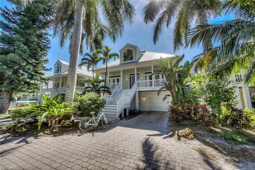 Captiva’s VILLAGE BY THE SEA!! Recently updated, this 4bed/4bath Old Florida style home is located in the heart of Captiva! ‘All Seasons Villa’ offers the best of the Island Lifestyle featuring its own private pool with a natural barrier plus proximity to shopping, marinas, and renown restaurants. Arrive through the lush landscaping and up the front staircase (or elevator) into the main level that is bright, airy, and spacious. An open floor plan boasting hardwood floors in the living areas, kitchen with granite counters, coastal furnishings, and multi-level decks installed with composite wood. Lower level offers expansive interior storage. A covered patio, artificial turf surrounding the heated pool, and an under building 2-plus vehicle garage with an additional storage area leading to the pool deck. Roof-top deck offers partial gulf and sunset views! Approximately 500 feet from the beach, this home is the epitome of what Captiva Island is all about!