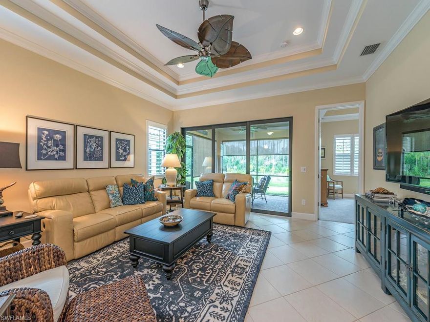 You will love this meticulously maintained Barcelona model located in the highly desirable community of Bonita Isles. From the minute you enter -- this home's upgrades will impress, beginning with the large living area open to a charming kitchen boasting beautiful cabinetry, GE appliances & granite counter tops with matching back splash. Diagonal tile throughout the living area, hurricane impact windows & sliders, plantation shutters, crown molding throughout, custom ceiling fans and recessed lighting are just a few of this home's "extras."  All this AND a spacious master bedroom and master bath with a large walk in closet. There is an additional bedroom and full bath PLUS a large den. This home is one of the most desirable in Bonita Springs -- a spacious interior located in a stunning community, with a club house, resort style pool, two sparkling lakes, LOW HOA fees and NO CDD! Schedule your showing appointment today, before someone else finds this -- as anyone who visits this gem will quickly want to call it "home!"