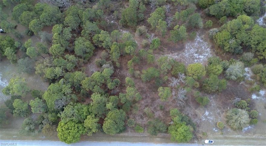 Scenic 1.09-acre lot located in Montura Ranch Estates, ideal for a private getaway or future homesite. Enjoy peaceful country living surrounded by natural beauty, offering a true escape from city life. Zoned to allow single-family, manufactured, and modular homes. Electricity is available; well and septic required. Internet service is available. Horses and other livestock are permitted. Community amenities include a park, pool, and clubhouse just minutes away. Access is via private roads. Permitted and surveyed driveway entrance already in place, providing legal access and saving buyer time and expense. Go see it today.