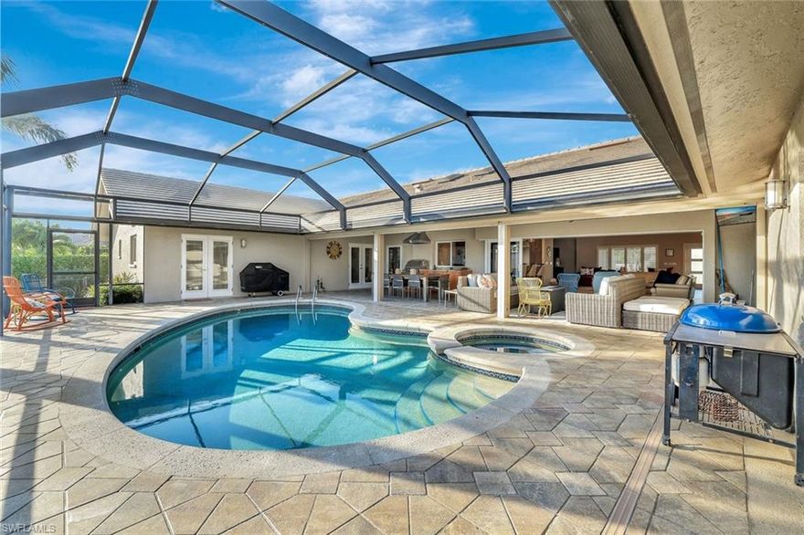 Beautifully updated waterfront home with gulf access on Collingswood Avenue. This meticulously maintained 4-bedroom, 4-bath waterfront residence located in one of Marco Island’s most desirable boating neighborhoods. Set on an oversized lot with southeast exposure, this home offers quick indirect Gulf access and a peaceful setting along a wide canal. Inside, you’ll find a bright, open layout with generous natural light, neutral finishes, and an effortless flow between indoor and outdoor living spaces. The kitchen features updated cabinetry, quartz countertops, KitchenAid stainless appliances include two dishwashers, separate ice machine, two refrigerators, plus a Thermador 5-burner gas range, and a large breakfast bar perfect for casual dining or entertaining. The spacious living and dining areas open to the lanai, creating an ideal backdrop for enjoying the water views. The primary suite offers a private retreat with direct pool/lanai access, a walk-in closet, and an updated bath. Two guest bedrooms are thoughtfully situated on the opposite side of the home, providing comfort and privacy for family and visitors. Step outside to a screened lanai with built-in firepit overlooking the sparkling pool and expansive waterfront. The property includes a dock with a RARE 14,000 lb covered lift, making it easy to enjoy boating, fishing, and exploring the surrounding waterways. Mature tropical landscaping frames the yard and enhances the home’s curb appeal. Additional highlights include a temperature-controlled wine room, impact-rated windows and doors, a 4-car garage for the car enthusiast, a metal roof, whole-house generator, Sonos sound system, storm screens on rear lanai, Kinetico water system, 500-gallon propane tank, indoor fitness room, all in a well-designed split floor plan. Whether you’re looking for a full-time residence or a vacation retreat, this home offers the relaxed coastal lifestyle Marco Island is known for—just minutes to white-sand beaches, dining, and shopping.