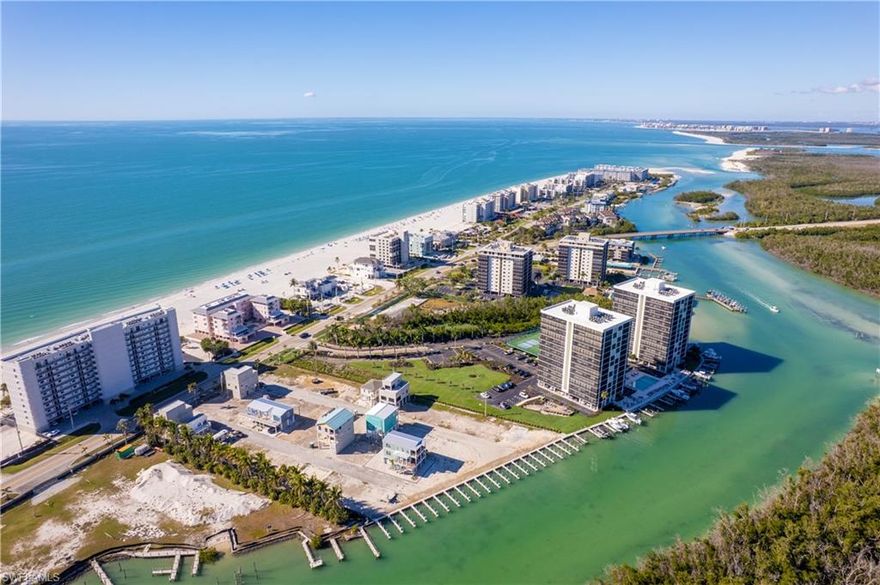 BUILD YOUR PARADISE RETREAT...BEACH ACCESS STEPS AWAY...GULF ACCESS VIA HOGUE CHANNEL WITH DOCK INCLUDED...HOUSE PLANS AVAILABLE TO USE OR CHANGE TO FIT YOUR NEEDS...SURROUNDED BY MULTI-MILLION $$$ PROPERTIES FOR A FRACTION OF THE PRICE!

~Nestled in the quaint community of BONITA BEACH VILLAGE (which will be lushly landscaped once all the building is done), is this wonderful lot. This community will have approximately 30 elevated homes once all completed and lots are rare, as most the owners of the lots are building their own homes. New docks and seawall have been completed.

~This property is only steps from your own dock, with water views to the East, the beach to the West, and a lushly landscaped back view with no homes behind you! If you decide to build a home with a rooftop deck, you will also have spectacular beach and bay views! (even without a rooftop deck you will have bay views!)

~Seller has paid $25k for a set of plans which are already approved by the city. Buyer could use or have amended if desired. Approved plans would help bypass many steps and save time in moving ahead to building. 

~Steps to the beach to sink your toes in the sand and marvel at the ever changing Florida sunsets, visit the dolphins and manatees at the docks, take your boat out to explore the back bay and Gulf waters, walk to Docs Beach House, Coconut Jacks Restaurant, and a short drive to fine dining and shopping at The Promenade, Coconut Point, and Mercato Mall. Only 30 minutes to the airport.

~The price and value cannot be beat at this premium location!
~Low HOA fees of $2000 annually make this the perfect place to build your home or "Home away from Home".