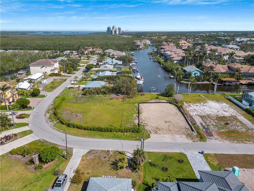Spectacular DOUBLE LOT with Gulf-access located ONLY A 5-MINUTE BIKE RIDE TO BAREFOOT BEACH! Fantastic waterfront opportunity for your future dream home located on .59 acres with gulf-access. Also an excellent investment opportunity with no rental restrictions. This location is a beach & boater’s dream and is zoned TFC2 allowing construction of a single-family home, duplex or two attached villas with city approval. Delight in gorgeous natural light, breathtaking sunsets & prime sun on your future dream pool. This perfectly located lot is ready for you to make this your forever home on the water or your perfect rental opportunity. Prime location West of US-41, close to casual & fine dining & easy access to RSW Airport, the Promenade, Mercato & Waterside Shops. Only 15 miles to Naples 5th Avenue South.