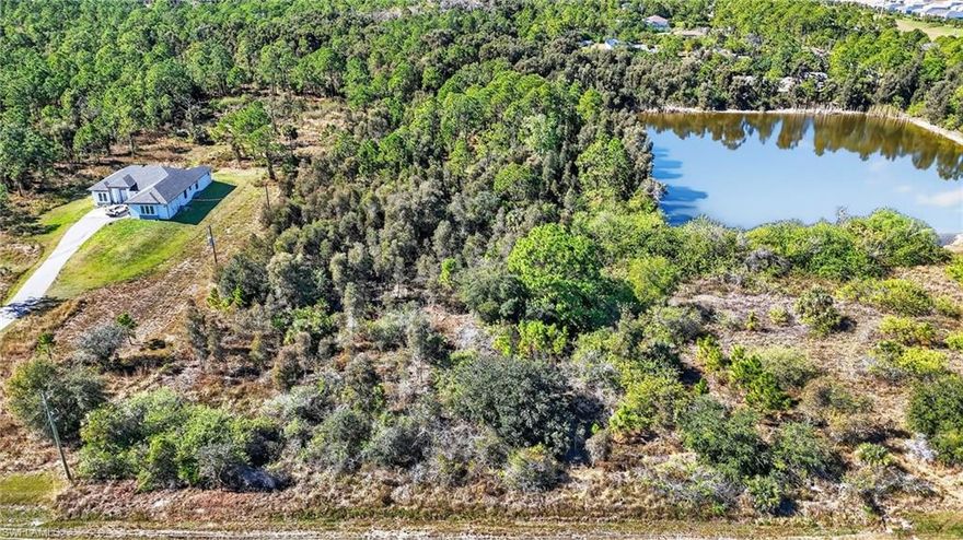 A Strategic Hub for Institutional & High-Impact Commercial Use

Rare in scale and logistically superior in location, this 7.48± acre assemblage is engineered for developers who prioritize accessibility and future-proof positioning. The site is uniquely suited to capture the immense "daily needs" traffic generated by the massive residential influx to the East, serving as a vital link between established North Naples and the emerging master-planned communities. Its dual-lot structure and extensive linear frontage provide the critical engineering flexibility required for complex ingress/egress designs and high-occupancy facility planning.

Engineered for Efficiency & Cost Savings
A standout feature of this property is the existing private lake, which serves as a pre-integrated infrastructure asset. This lake can be strategically utilized for retention and runoff compliance, meeting strict environmental and developmental regulations without the need for additional excavation. By leveraging this existing feature, a buyer can save thousands of dollars in engineering, permitting, and construction costs that would typically be required to build a new drainage system.

Value-Add Potential
In an environment where entitled, high-visibility land is becoming increasingly scarce, this site offers a clear path to value-add completion. The transition of the surrounding corridor toward a denser, service-oriented landscape makes this parcel a primary candidate for a variety of high-intensity uses that are currently under-represented in the immediate area.

Secure a high-yield asset positioned at the center of the county’s most significant long-range infrastructure investments.