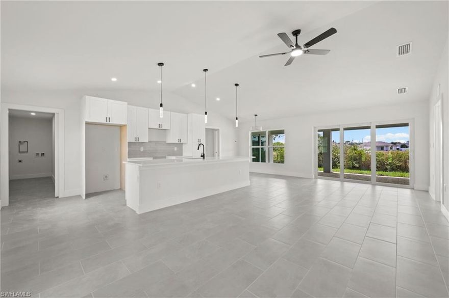 Step into this brand-new 2026-built home situated on an oversized canal lot! 

NOT LOCATED IN A FLOOD ZONE! Offering 1,683 sq ft under air, this property features 4 bedrooms, 3 bathrooms, and a 2-car garage. Perfectly situated in NE Cape Coral, the home delivers modern Florida living at its finest.
The interior showcases beautiful tile throughout, soft-close cabinetry, his-and-hers sinks, and stylish finishes from top to bottom. An open-concept layout, split-bedroom design, and abundant natural light make the home both comfortable and inviting.

CO expected within 30 days