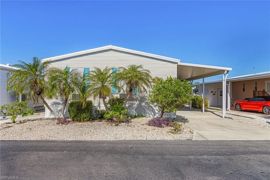 Spacious and well maintained, this home offers lots of storage.  This home had no water in the house from any of the recent storms.  This home features a large great room, a glassed in porch on the water with a portable A/C unit, a small patio, a boat lift, an in home laundry room with sink and extra storage, and covered parking.  Come see this home to appreciate the spaciousness.