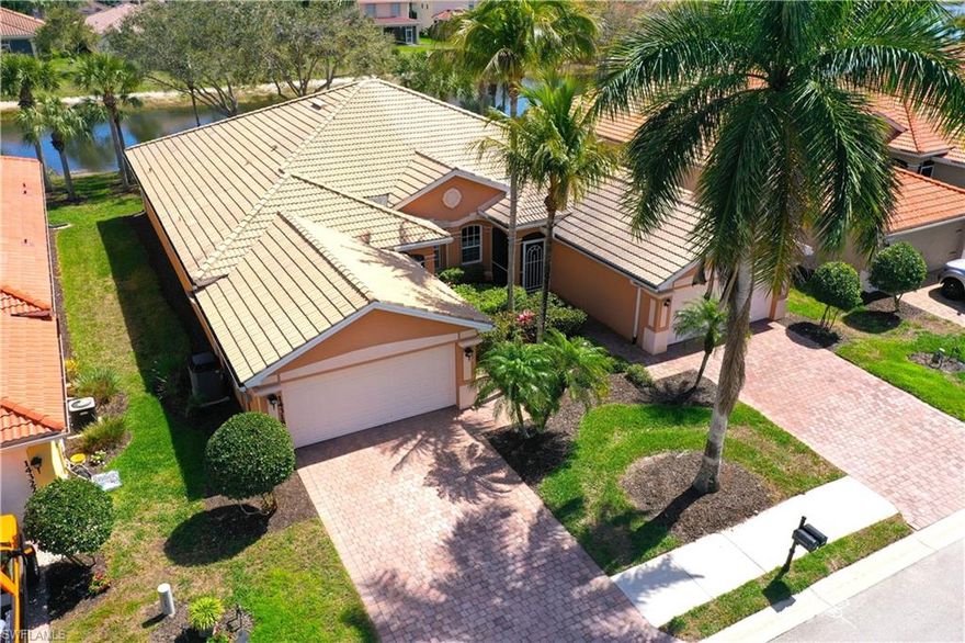 Professional interior pictures coming! Lovely lakefront villa in desirable Reflection Lakes gated community. This home offers beautiful lake views from the spacious screened lanai. Many recent upgrades throughout including AC (2022), brand new luxury vinyl tile flooring (late 2025), gas powered generator, Plantation Shutters on windows, recessed lights, upgraded fixtures, 6 inch crown and baseboard molding, master and guest bathrooms renovated in 2025, new high-quality Penntek concrete coating on garage and lanai floors (lifetime warranty), re-imagined lanai (2024), and whole-house ENVIRO water filtration system with 50-gallon hot water tank. The kitchen offers wood cabinetry, stainless steel appliances, granite counters, a breakfast nook and a pass through to the dining living space. The master bathroom is spacious and the ensuite bath features a frameless glass enclosed walk in shower, upgraded lighting and dual sinks. The additional bedrooms provide plenty of space for friends and family. A built in Murphy bed allows conversion to office or bedroom. All windows have electric hurricane shutters for optimum protection. Low fees and no CDD, Reflection Lakes provides a clubhouse that consists of a state-of-the-art fitness center with locker rooms and showers, rooms for meetings and activities, Library, billiards, ballroom, catering kitchen, outdoor heated pool with splash area, bocce ball, BBQs and pavilion. Reflection Lakes is a short distance from downtown Naples, Marco Island, shopping, and attractions.