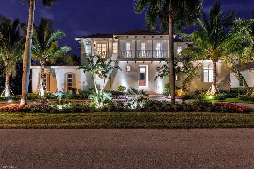 H.14793-HUGE PRICE REDUCTION! Named for its lake views & tranquil tropical setting, “Vista Serena” sits on preferred southern exposure, lakefront corner lot, just 4 doors from Naples’ pristine white sand beaches. Coastal décor, 5BR+Den/5+BA built in 2016. Designed by John Cooney, built by BCB luxury home builders w/highest levels of style & construction. Automated smart home. Wide plank wood floors, clean, sophisticated white & pale gray backgrounds. High tray ceilings w/beams & custom moldings. Chef’s dream kitchen w/huge, Pompeii quartz island, commercial grade stainless sink, W/I pantry, Wolf gas range, SubZero fridge, 2 dishwashers, + prep sink. 448 bottle glass-enclosed wine room. Light-filled, open concept w/floor to ceiling sliders to lanai w/roll shutters, full summer kitchen & EVO grill. Infinity edge pool w/spa, lakeside deck & fire pit. Luxurious 1st floor master w/2 showers, 2 W/I closets, soaking tub, exquisite marble/tile mosaic details. Elevator from garage to both living levels. A second family room upstairs +3 guest suites. Car collector’s oversized 3 - 6 car garage w/room for lifts! Furnished, w/unique, hand-selected imported pieces.