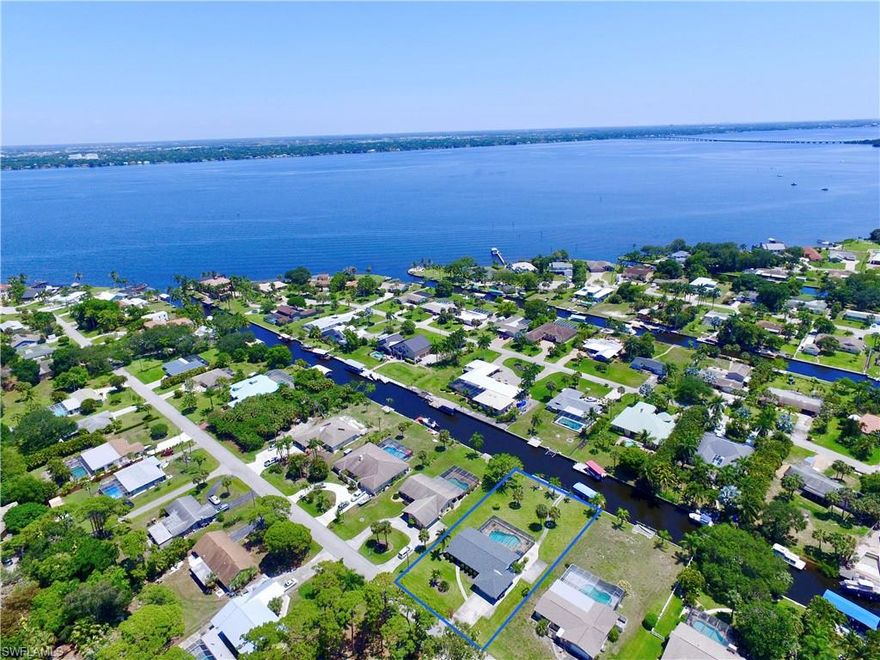 Location, Location. Located almost at the riverfront in a well known neighborhood with all waterfront homes surround. This Gulf Access Home with best water view, comes furnished and turnkey. Home is on a almost half acre lot with plenty of privacy. Just installed a new roof, new AC, new pool heater and recently fresh painted outside. When you walk in you feel that open floorplan and have your view through the wide sliding glass doors to the pool area. Tile flooring throughout whole house. The kitchen is huge, fully equipped, has granite countertops and stainless steel appliances. The 2 bathrooms have been already updated. Pool and deck area with plenty of space, dining and lounge area. The wrap around boat dock with boat lift also has a boat lift canopy to protect your boat. Full loaded Landscaping around the house. Right now a very successful vacation rental with great booking quote. Great deal for a investor or just move in as your primary residence. House comes fully furnished and equipped. Please check out the virtual tour as well.