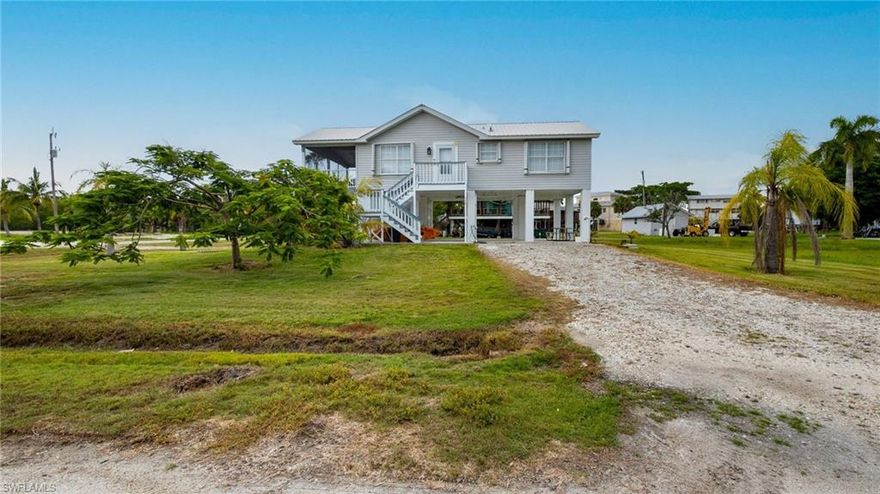 Town and Country living!!!! Come embrace your inner outdoors man! This 2 Bedroom & 2 Bath Everglades City Stilt Home w/ assumable dock. This is a boater and Fishermans dream paradise, and minutes out to the Gulf of Mexico! +/- $100,000 in upgrades including LVT floors, solid wood cabinets, quartz counters, metal roof, fresh paint inside and out, and near the boat launch! You will not want to miss your chance to own this home! Close to Publix and shopping in Naples. Call for your private showing today!