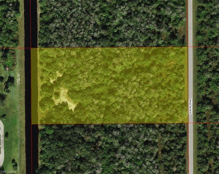 Over 5 acres lot in a growing area of Golden Gate Estates. Very quiet area, nevertheless convenient to grocery shopping and future commercial area. The back of the property faces a canal. 
Built your dream home among trees and lush vegetation for your complete privacy.