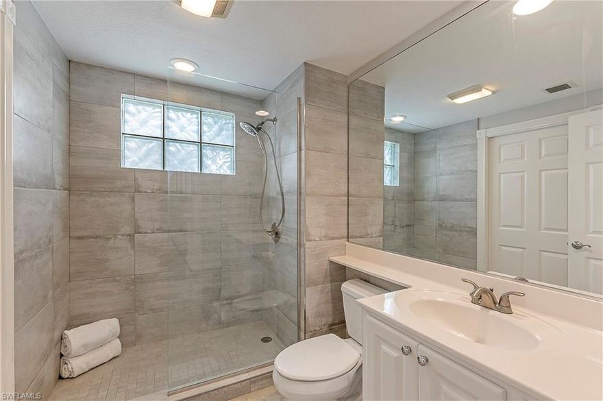 H.16224 - This original DiVosta "Built Solid" town home is located very close to the town center, community pool, restaurant, bagel shop, tot lot, pickle ball, bocce, and tennis. Extensive tropical landscaping invites you inside.  This home has 3 bedrooms all with en-suite baths and large walk in closets. All closets feature "California" style closet inserts. Vinyl plank flooring highlights the stairs and second floor. Beautiful stainless appliances are 3 years old. Central vac helps you keep these low maintenance tile and wood floors clean. Detached garage has a window for natural light, attic pull down stairs, and an insulated garage door.  Courtyard rescreened in 2020.  Villagewalk is an active community with 22 miles of sidewalks, walkways, and pedestrian bridges.