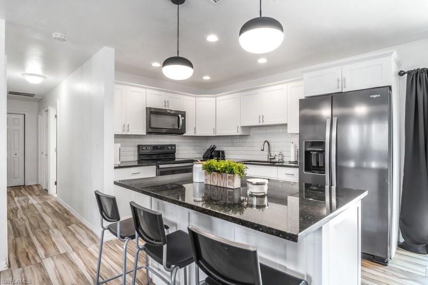 This FULLY REMODELED Modern home is ready for you!  Brand New Solar Panel System just installed on the New Metal Roof! 3 Bedrooms PLUS a Large Den! New A/C, New Electrical Panel, New Water Heater! HUGE FULLY FENCED BACKYARD offers plenty of room for pets, kids, and a pool, it is one of the largest lots in the neighborhood. With Gorgeous White Shaker Cabinets, Stainless Steel Appliances, Granite Countertops, and Beautiful Floors, this open concept home has all the upgrades! The huge driveway also has side parking for a boat or RV. Fort Myers Shores is the perfect location just steps away from the Caloosahatchee River and minutes from I-75! Solar Panels will be completely paid off by seller at closing, making your electricity bill virtually non-existent!