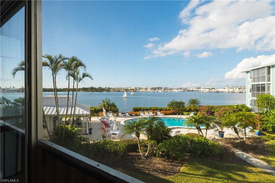 The moment you walk in the door of this condo you can’t help but be mesmerized by the truly breathtaking views of Naples Harbor. Ample windows in the living room, master bedroom and one of the two guest bedrooms become pictures in motion as yachts and sail boats pass by... all day long. When night falls you will be treated to beautiful sunsets and lights from the marina across the way as they reflect off the water. This end-unit is spacious and well maintained with granite and stainless-steel appliances in the kitchen. Four Winds is a 55+ community that sits a short 1.5 miles from the upscale shops and restaurants that line 5th Ave S, and just a few short blocks to the beautiful white sandy beaches of Naples. Docks are available for purchase or lease at prices that make it affordable for even a novice boater who wants to experience direct access to the Gulf of Mexico, with no bridges on their way to open waters. The best thing about Four Winds are the people, they epitomize the meaning of community. This is a rare opportunity to become part of a tight knit community where owners seldom leave but instead easily convince family & friends to join them on the shores of Paradise.