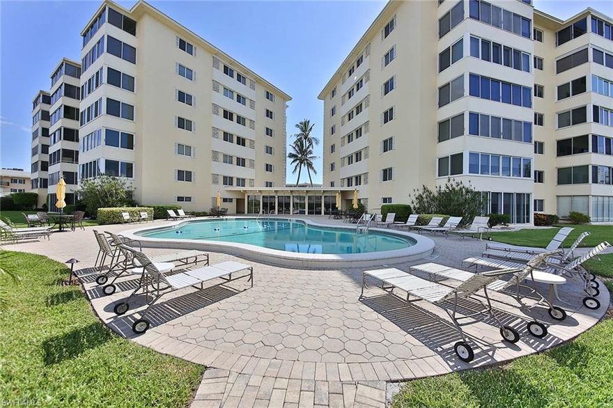 AVAILABLE SEASON 2027 with a 3-month minimum.  Enjoy SUNSET VIEWS over the Gulf from the patio of this 5th floor 1 bedroom (plus a Murphy Bed) / 1.5 bath condominium located directly across from the beach on Gulf Shore Blvd. in The Moorings. The large community pool and deck over looks Naples Bay and even has a fishing dock! The Primary Bedroom suite features a King-Sized bed and an ensuite bath with a shower/tub combination.  The living room offers a Murphy Bed and there is an additional a half-bath for guests.  Harborside West is a secured building located directly on Moorings Bay.  The community offers a heated pool, BBQ area, exercise room, and a community room. Walk to the beach for the day and to Venetian Village for shopping, lunch or dinner.  Covered parking is provided.  Association does not allow pets. Includes 2 Flat Screen TVs and WIFI.