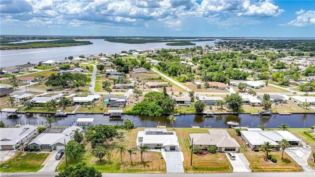 Photo of 27385 Voyageur DR, PUNTA GORDA, FL 33983 (MLS # 225083905)