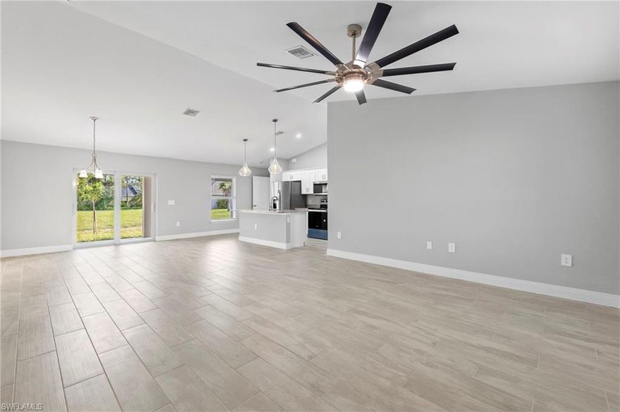 NEW CONSTRUCTION - No Flood Zone. Construction will be completed on or before 10/15 . This stunning new build features 4 bedrooms and 2 full baths with a split floor plan and UPGRADES GALORE. Impact windows and doors. White shaker style cabinets in the kitchen with a huge island, granite countertops and stainless-steel appliance package. The home features wood grain ceramic tile throughout the entire home. The split floor plan gives the master bedroom additional privacy and the master bath boasts a double bowl granite vanity top, tiled shower surround and a HUGE walk-in closet. Upgraded with designer lighting fixtures and ceiling fans throughout. The home also boasts a 22' wide under truss lanai, paver driveway and epoxy coated garage floor. The professionally landscaped yard and auto irrigation sprinkler system complete this wonderful new build. Schedule your showing today. Please be sure to watch the video tour as well as the 3D Matterport Tour. Exterior pictures shown do not reflect the property's actual lot. The home for sale is identical to the home represented in the pics but will be located on a different lot than what is shown in the pictures and videos. Schedule your showing today. AGENTS, PLEASE READ CONFIDENTIAL REMARKS