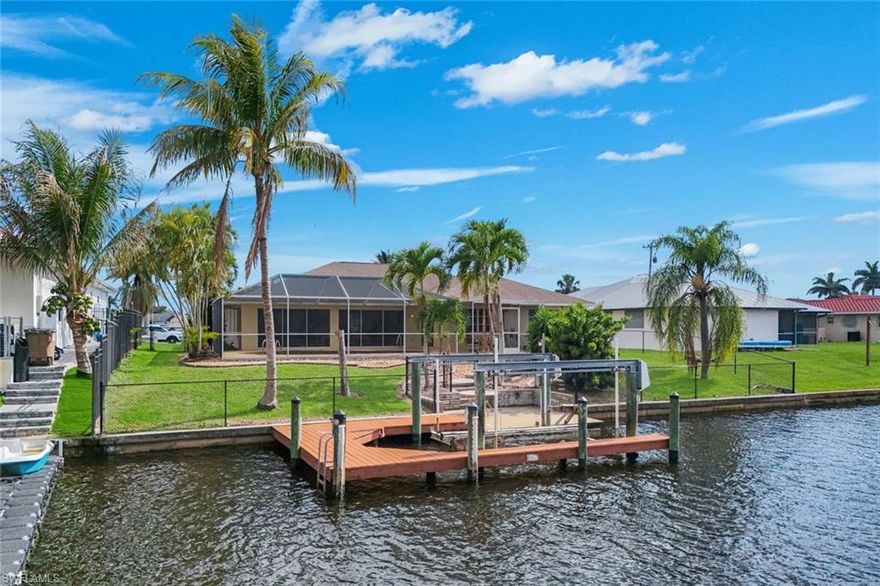 Direct Gulf Access – Just Bring Your Boat! Skip the long canal rides; this remodeled waterfront gem is located just off the Caloosahatchee River and comes complete with a boat dock and lift. Offering over 2,080 sq. ft. of living area, this 3BR + Office home is designed for entertaining. You’ll love the open kitchen’s rich solid wood cabinetry with granite counters and the modern quartz vanity in the owner’s suite. Sit back and enjoy the boat traffic from your lanai or open the three sets of sliders and invite the waterfront beauty into your living room creating a bright, airy atmosphere. Minutes from the best of Cape Coral and Fort Myers—coastal living has never been this easy!