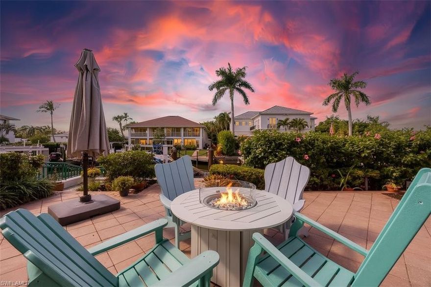 Luxury and lifestyle meet in this stunning, elegant, and serene waterfront villa.  This captivating end-unit villa in Oyster Bay offers sweeping western sunset views and direct Gulf-access waterfrontage. Nestled on a quiet cul-de-sac just minutes from downtown Naples, it seamlessly blends bright, light-filled interiors with expansive outdoor spaces, creating an idyllic coastal boating paradise.  The 2,107-square-foot residence centers around a sun-drenched open living area featuring beautiful wood floors, designer fixtures, and a built-in fireplace that connects the charming interior courtyard to the waterfront backyard. The chef’s kitchen impresses with custom cabinetry, premium quartzite countertops, stainless-steel appliances, a coveted gas cooktop, integrated wine cooler, wet bar, and breakfast bar. Thoughtfully designed across two levels, each bedroom is upstairs and delivers a unique tranquil escape, a private bathroom, and a dedicated outdoor space. The primary suite, with walk-in closet and spa-like ensuite bathroom is a showstopper with unobstructed panoramic sunset views from its west facing balcony. In addition to another bedroom, full bathroom, and study, the second floor includes a guest suite with its own spiral staircase access from the interior courtyard, a kitchenette, and sitting area.  The unique outdoor space of this villa is really what sets it apart with an intimate courtyard, sunlit private pool and spa, and extended Southern facing deck.  For the boaters, access to the Gulf is quick and easy with no bridges, and the generous 40-foot boat dock can accommodate a vessel up to 34' and a future boat lift. Surrounded by lush tropical landscaping, the property also includes a two-car garage, an extra parking space, and paved area for two-wheeled transportation. Built for resilience, it features impact-resistant windows and doors, a newer roof, and elevated construction that remained dry through multiple storms.  Minutes from downtown Naples’ vibrant 5th Avenue South, world-class beaches, shopping, and dining, this rare southern-exposure waterfront gem perfectly embodies luxury, comfort, and the quintessential Naples lifestyle.