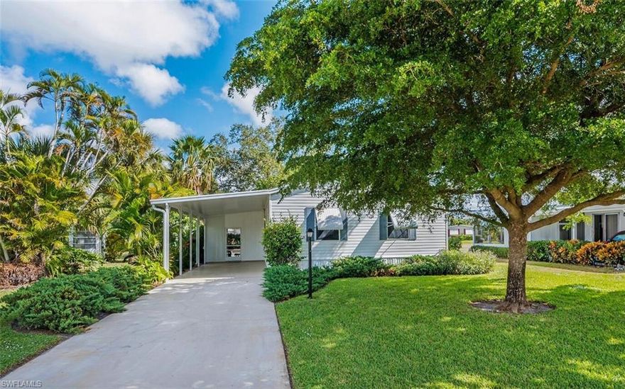 This attractive and well maintained 2BR/2BA home, which was built in 2006, features a NEWER SHINGLE ROOF and a large (almost 300 sq/ft), screened-in lanai surrounded by lush landscaping for privacy. The spacious kitchen, with island, and open floor plan provide ample space for entertaining family and friends. The flooring in the living room/kitchen/bedrooms is laminate and the Cathedral ceilings add to the bright and spacious feel of the interior. The Master BA features a walk-in shower and dual sinks. The washer/dryer are inside, so you'll be doing your laundry in the comfort of A/C. There is also a spacious shed which provides additional storage space. Riviera Golf Estates boasts excellent amenities, which include a newer heated community pool with lap lanes, tennis/pickleball/bocce courts, exercise room, billiards room, shuffleboard and a large clubhouse with a very active social calendar; and the HOA fee is one of the lowest in East Naples, just $128/mo. Riviera Golf Estates is a quiet and friendly 55+ community, and it is conveniently located, with just a short ten-minute drive to Downtown Naples, and only 8 miles from the Gorgeous Beaches Naples is famous for!