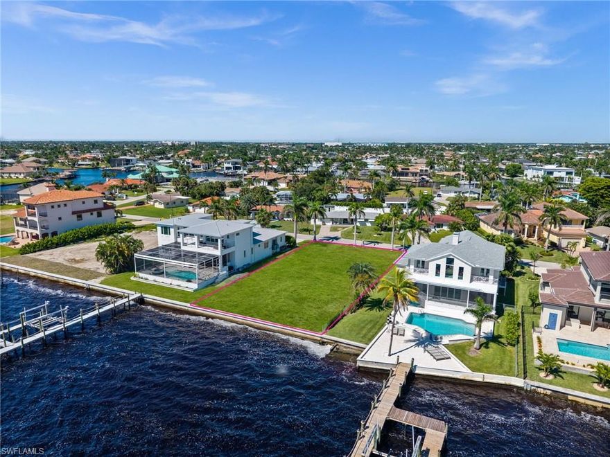 One or more photo(s) has been virtually staged, AI generated or rendered.  Experience a rare opportunity to claim your stake on Dolphin Drive’s most coveted riverfront stretch. This oversized Gulf-access lot, boasting sought-after southern exposure and panoramic water views, is the ultimate canvas for a world-class estate.

Imagine mornings on your private dock with the sunrise reflecting off the river and afternoons spent cruising to Sanibel or Captiva. Life here is defined by salt air, open water, and the effortless transition from a day on the Gulf to a sunset at home.

Located just a short stroll from the Cape Coral Yacht Club, you are at the heart of the city's most exciting evolution. With the Yacht Club’s "resort-style" redevelopment currently underway, featuring expanded beaches, a 47,000 sq. ft. community center, and a premier marina, this location isn't just a home site; it’s a front-row seat to Southwest Florida’s next great coastal destination.

Build your sanctuary. Live the legacy.
Note: The attached Yacht Club visuals are design renderings of the planned concept, not current photographs.