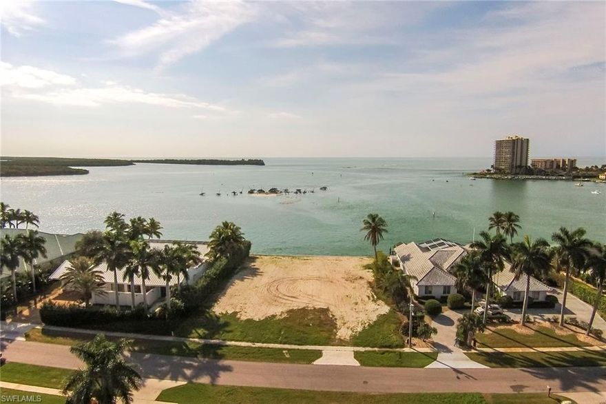 Incredible opportunity to own and build your dream home on this Gulf-side, half-acre, direct-access, south- and southwest-exposure lot with incredible wide-water views of Caxambas Pass, the Gulf of Mexico, area islands and city skyline in the distance. This homesite is ready to be built on, with a brand-new seawall and is now in the AE-11 flood zone, offering a significant savings for insurance and construction. This property is located on the coveted Caxambas Island in the prestigious Estate section of Marco Island, where you are surrounded by some of the island's most luxurious properties and represents an exceptional building site.