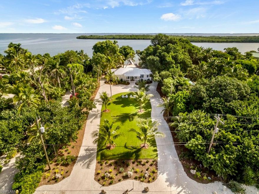 Gulf to Bay Serendipity - Opportunity knocking w/this Vintage totally restored cottage located along the best area of the Tween Waters stretch on Captiva Island. This idyllic 1925 getaway that exudes understated luxury creates romantic ambiance w/lush tropical gardens & breathtaking views of white sand beaches, amazing sunrise & sunsets and azure waters. The property showcases an awesome deepwater boat dock at the mouth of Pine Island Sound & Roosevelt Channel w/sought after original boat house that is truly special to have if given the opportunity. 102 ft of frontage & huge depth on a high ridge is another fantastic feature. The cottage features 3 bedrooms w/private baths, separate den/sitting area, great room w/sunset & sunrise dining, open kitchen, wood beams, original wide plank heart pine wood floors, ship lap siding, classic fixtures, white wood cabinetry, marble like counter tops, large open porch space and more. Rare to find original cottages on properties like this anymore!